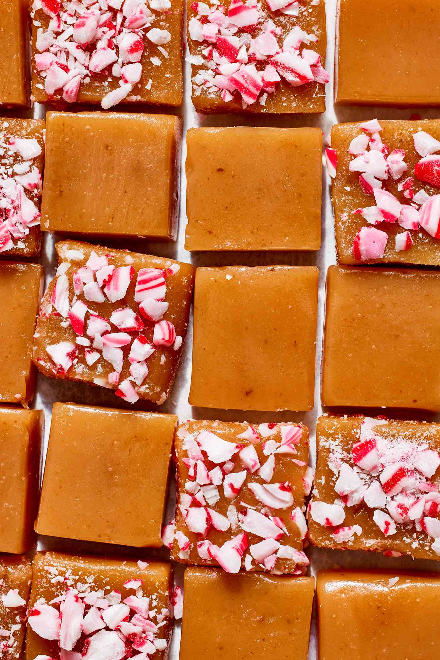 Peppermint Caramels Squares Lined Together (Some Have Crushed Candy Corn Toppings and Some Don't)