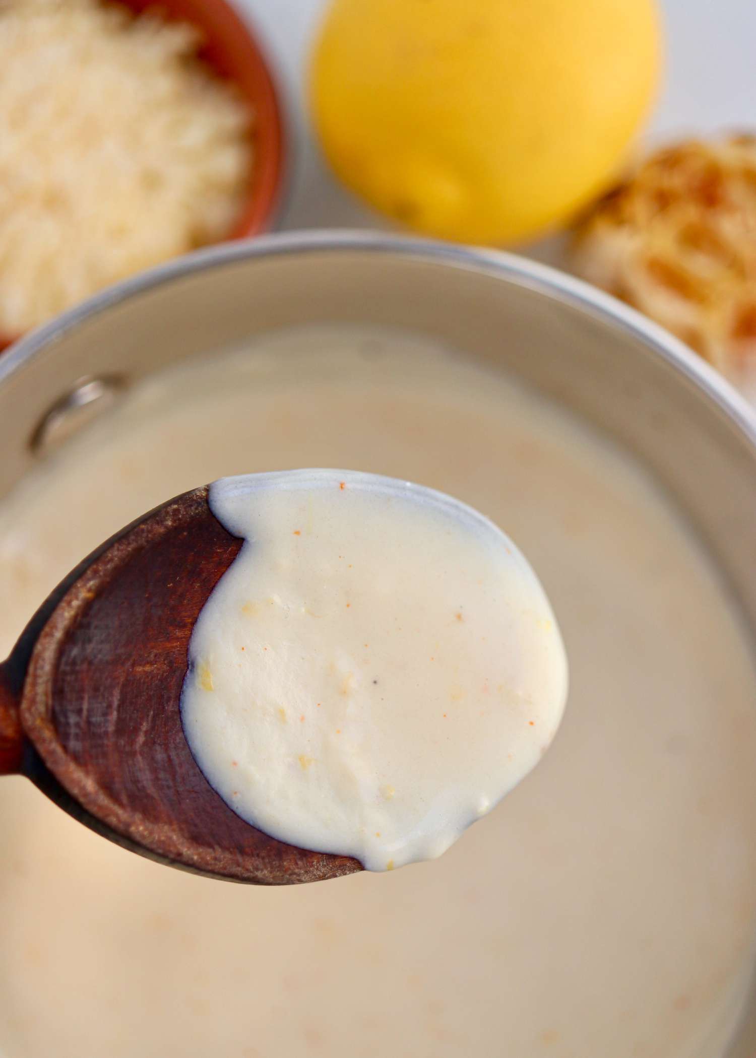 Easy Homemade Pizza Sauce on a wooden spoon.