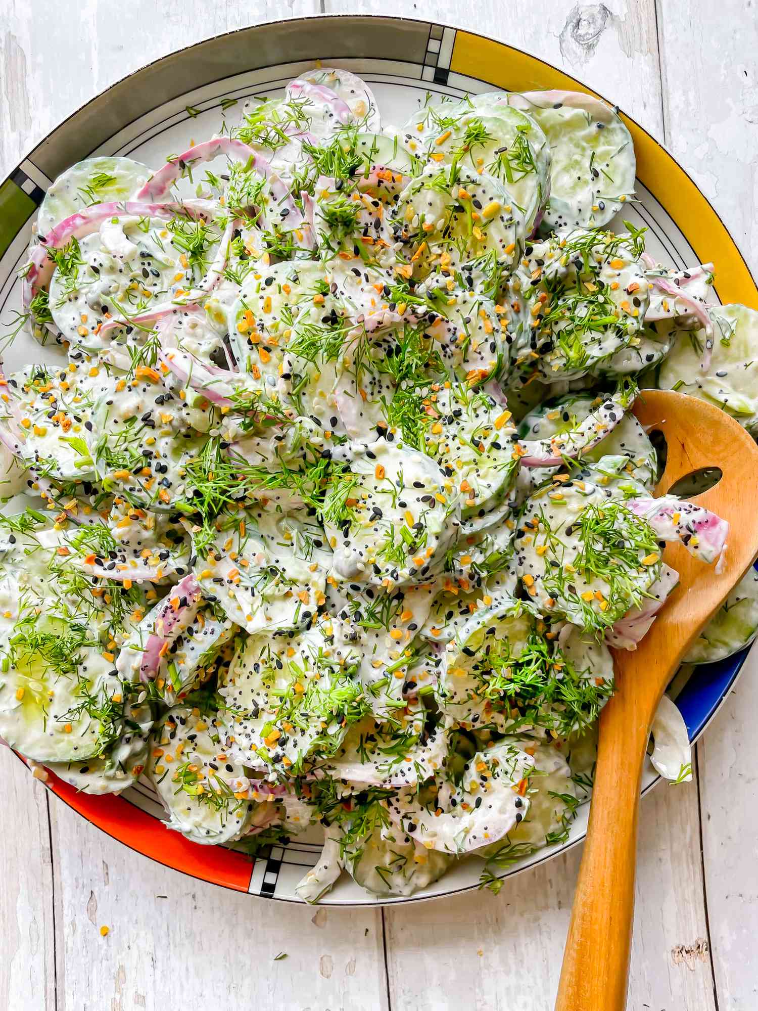 Everything Bagel Cucumber Salad with a Serving Spoon