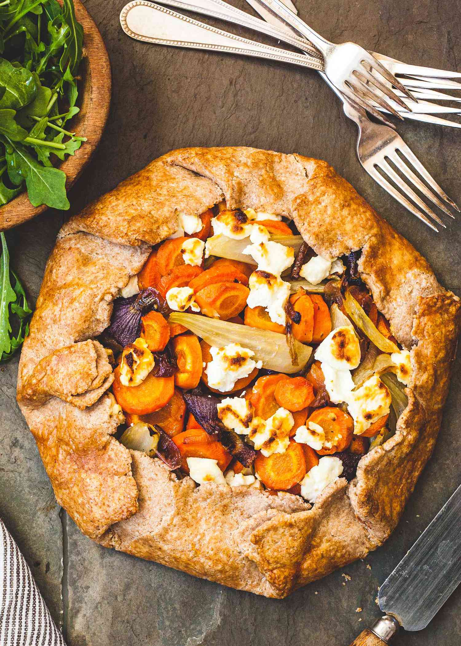 Savory Vegetable Tart with forks and a salad.